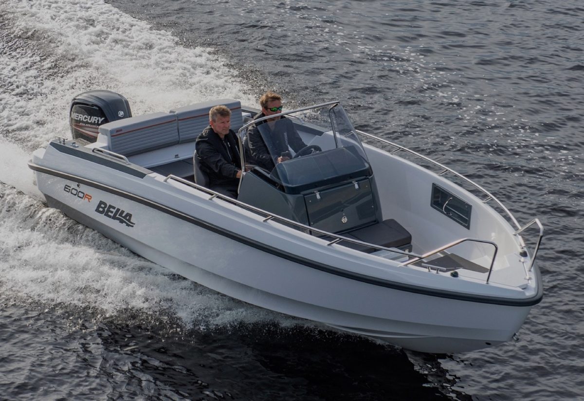 Two people driving in a motorboat