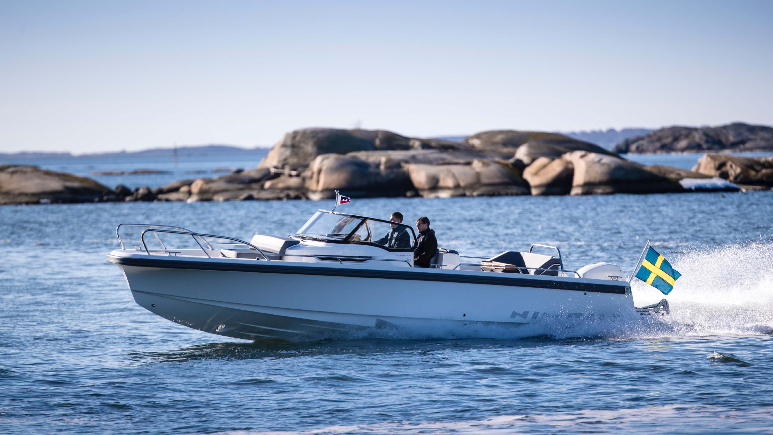 Nimbus boat driving in the water on a summer day