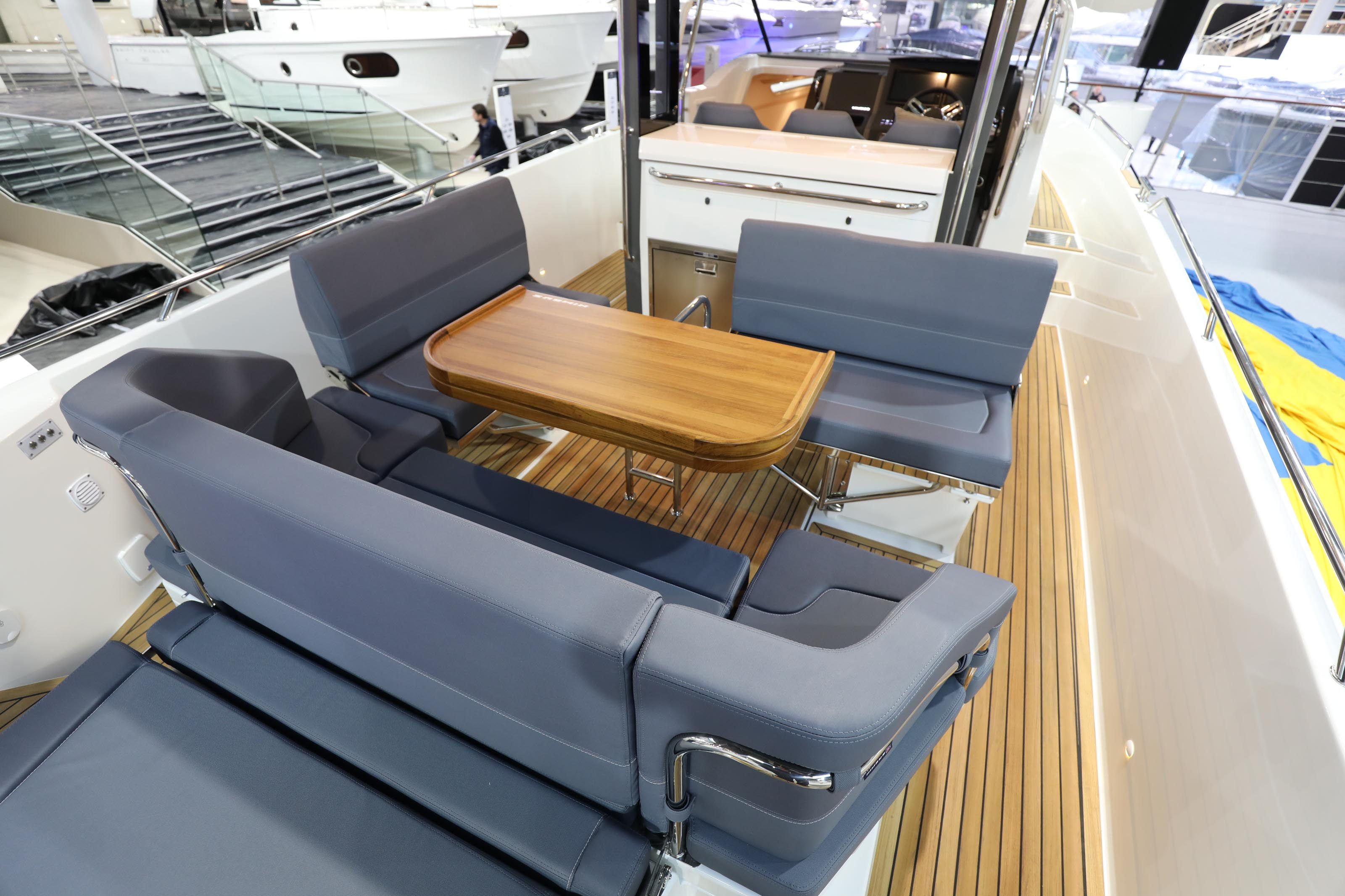 A table and chairs on a motor boat