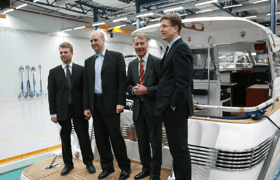 Swedish prime minister on a nimbus boat with other men