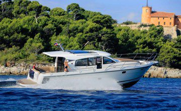 Nimbus boat with coupe in the ocean in the summer