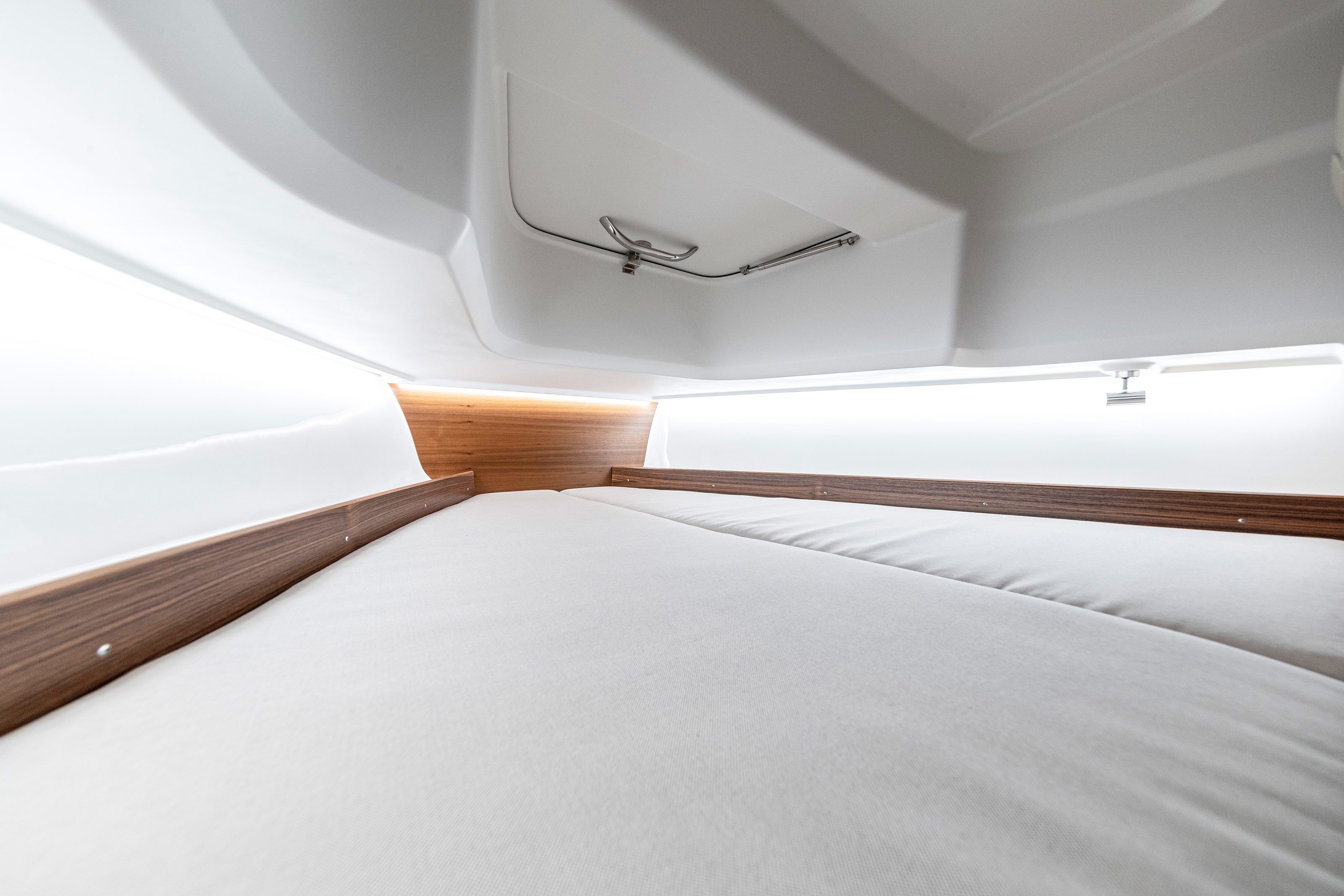 Cabin of a boat with white sheets