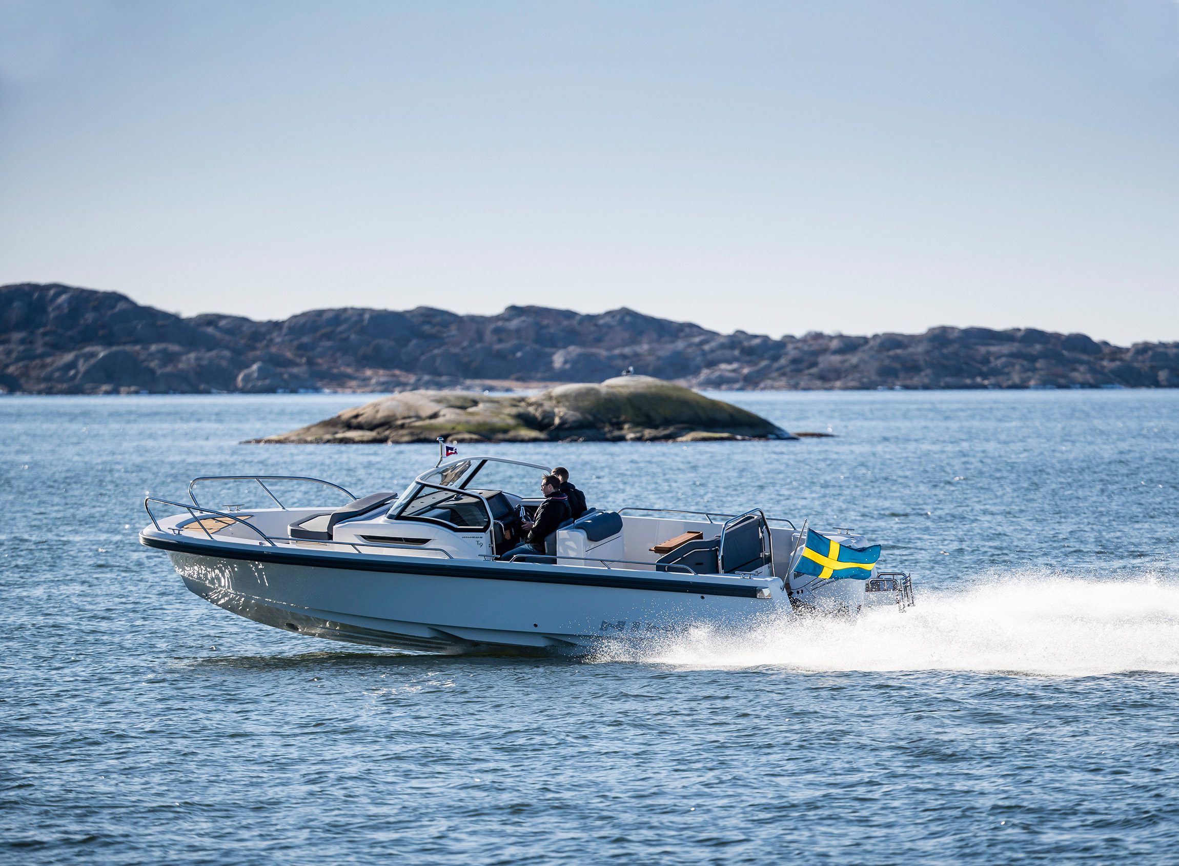 Nimbus boat driving in the ocean on a sunny day