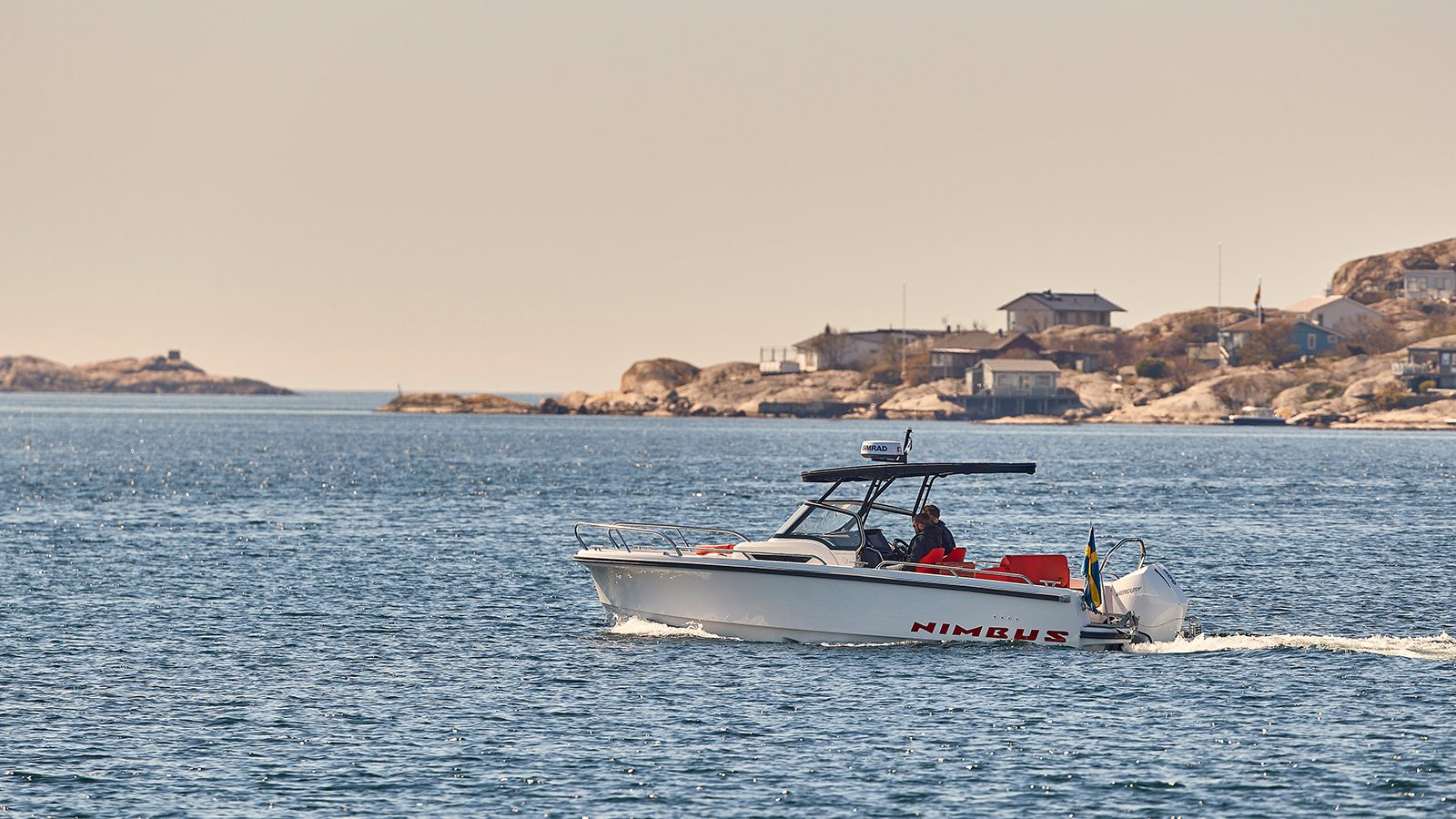 Boat driving in the ocean on a warm day